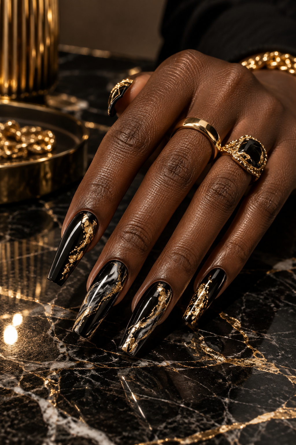 Glossy black coffin nails with gold foil and marble accents